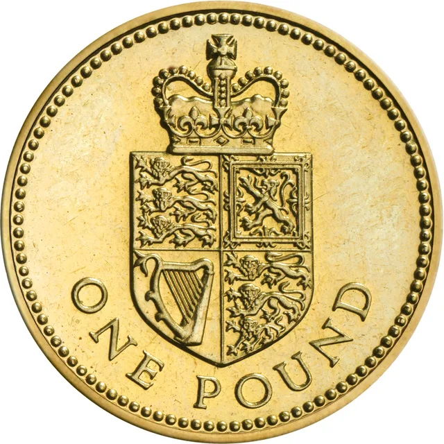 A crowned shield of the Royal Arms standing alone, with ONE POUND along the bottom of the coin