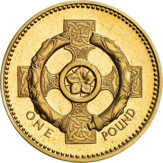 Celtic cross with pimpernel centre and the Broighter collar torc laid over it, ONE and POUND either side