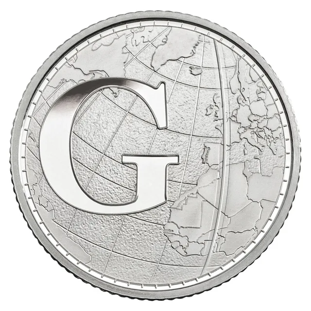 A globe with latitude and longitude lines and the Greenwich Meridian marked, behind a large letter G
