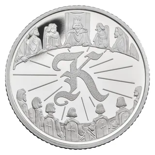 King Arthur and his knights seated around the Round Table, with a Gothic letter K in the centre
