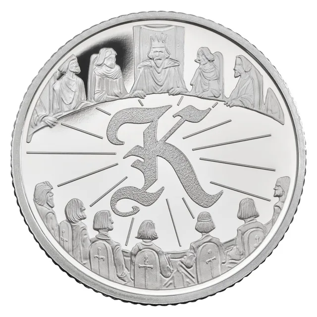 King Arthur and his knights seated around the Round Table, with a Gothic letter K in the centre