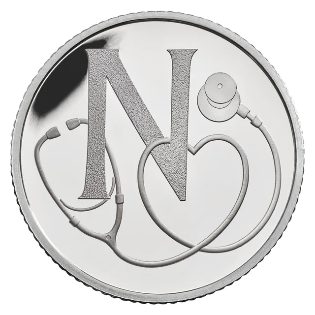 A stethoscope wrapped around a large letter N, its tubing curving into a heart shape