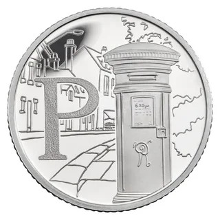 A pillar box on a street with houses, chimneys and a street lamp behind, beside a large letter P