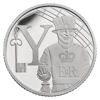 A Yeoman Warder beside a large capital letter Y with a key hanging from it, and the cypher E II R
