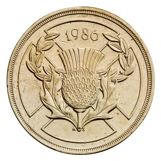 Scottish thistle in a laurel wreath over the St Andrew's saltire, with the date 1986 at the top