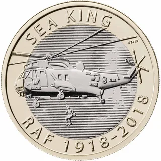 Sea King rescue helicopter flying left with a crewman on the winch line, SEA KING upper left and RAF 1918-2018 below