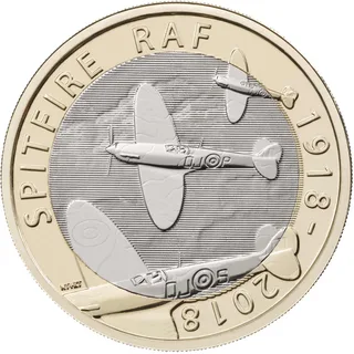 Three Spitfire fighters in flight, the largest crossing into the outer ring, with SPITFIRE, RAF and 1918-2018 around