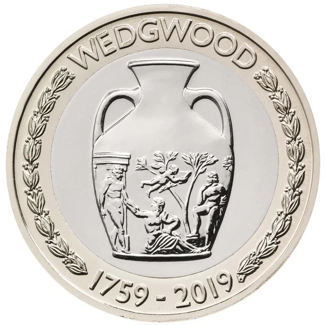 A two-handled Wedgwood vase with classical relief figures, WEDGWOOD above, dates below and laurel branches either side