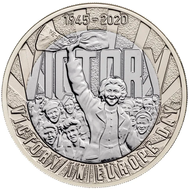 A woman holds a newspaper aloft in a cheering crowd, VICTORY in large letters behind and VICTORY IN EUROPE DAY around