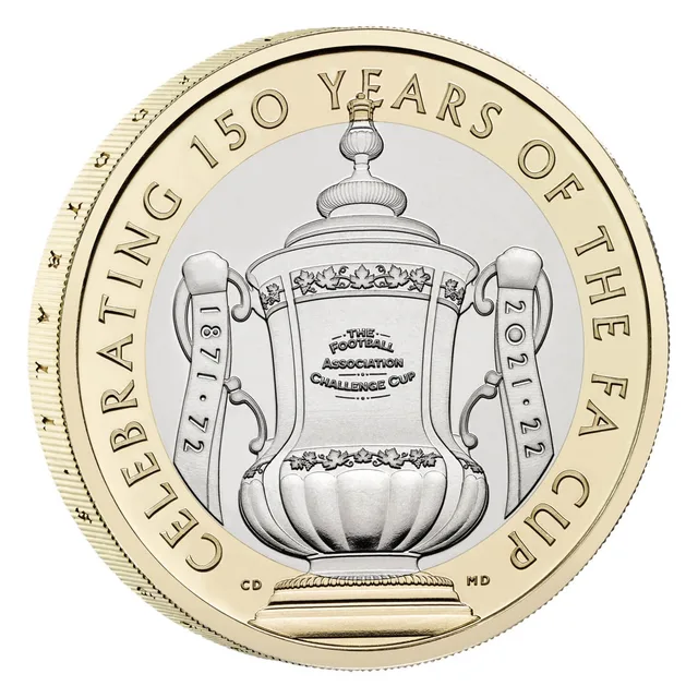 The FA Cup trophy in the centre, seasons at either side, with the anniversary inscription around the outer ring