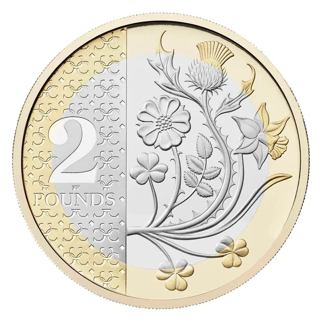 Large numeral 2 on a textured panel beside a spray of rose, daffodil, thistle and shamrock reaching the outer ring