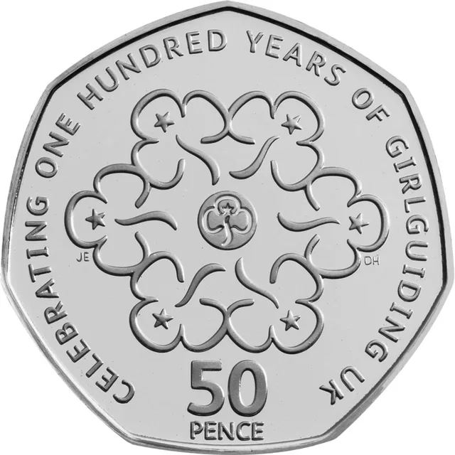 Seven Girlguiding trefoils, six around one, inside the words CELEBRATING ONE HUNDRED YEARS OF GIRLGUIDING UK