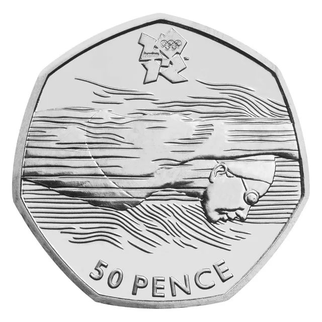 Swimmer in cap and goggles, face clear of the water lines, gliding right beneath the London 2012 logo