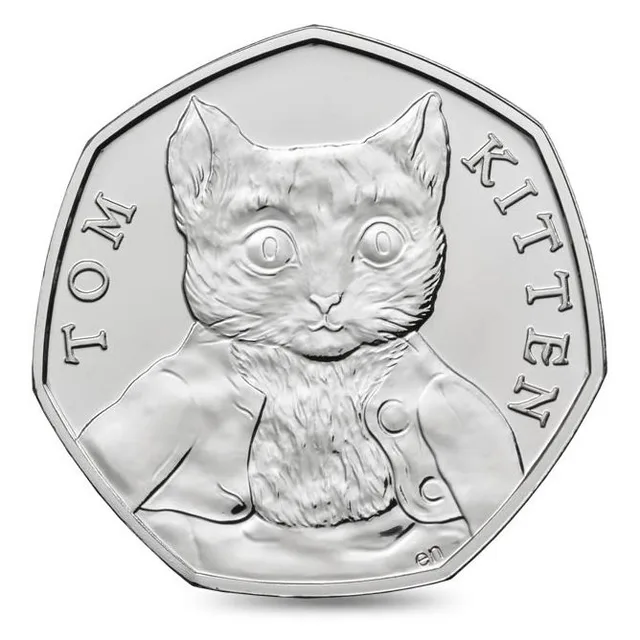Tom Kitten facing forward in his clothes at the centre, his figure dividing the name TOM KITTEN