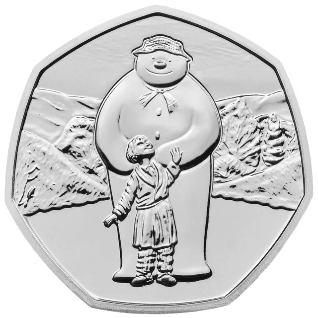 The Snowman standing behind James, a boy in pyjamas, with a mountainous landscape behind them