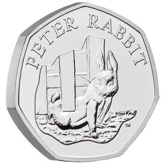 Peter Rabbit in his jacket scrambling under Mr McGregor's fence, with the name PETER RABBIT and a small TM mark