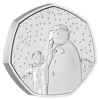 James, the boy, drawing a smiling mouth on the Snowman's face