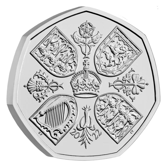 A crown surrounded by four shields in a cross, with a rose, thistle, shamrock and leek between them, and 2022
