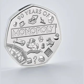 Mr Monopoly with the MONOPOLY logo among playing tokens and property cards, and a lenticular GO sign